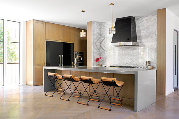 Contemporary kitchen with an accent marble wall.