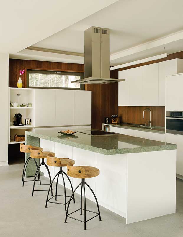 Contemporary kitchen with wood stools.