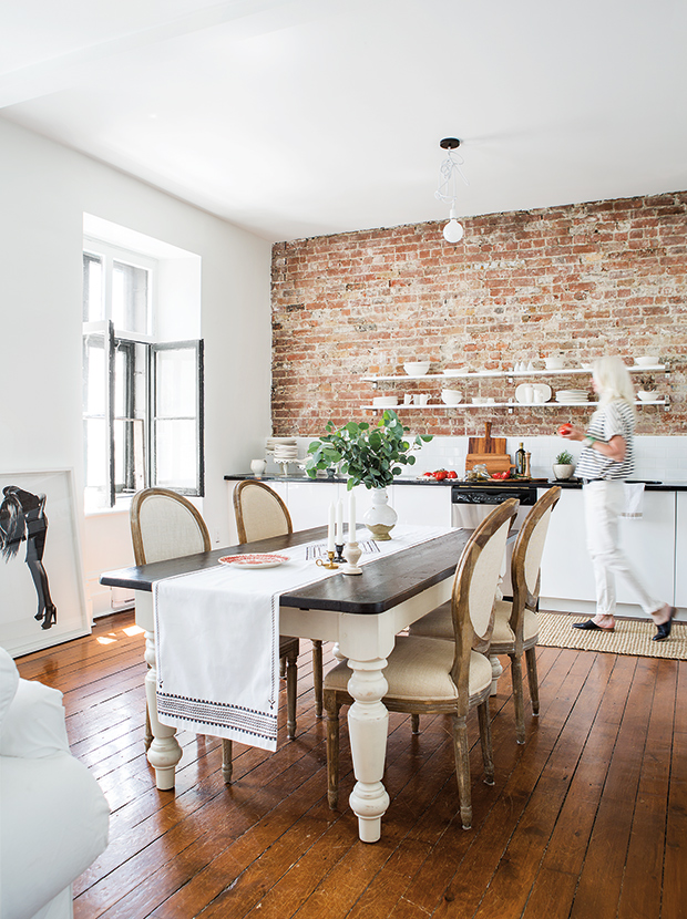 gallery kitchen with exposed brick wall