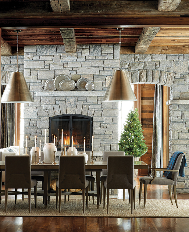Dining room with floor-to-ceiling stone fireplace.