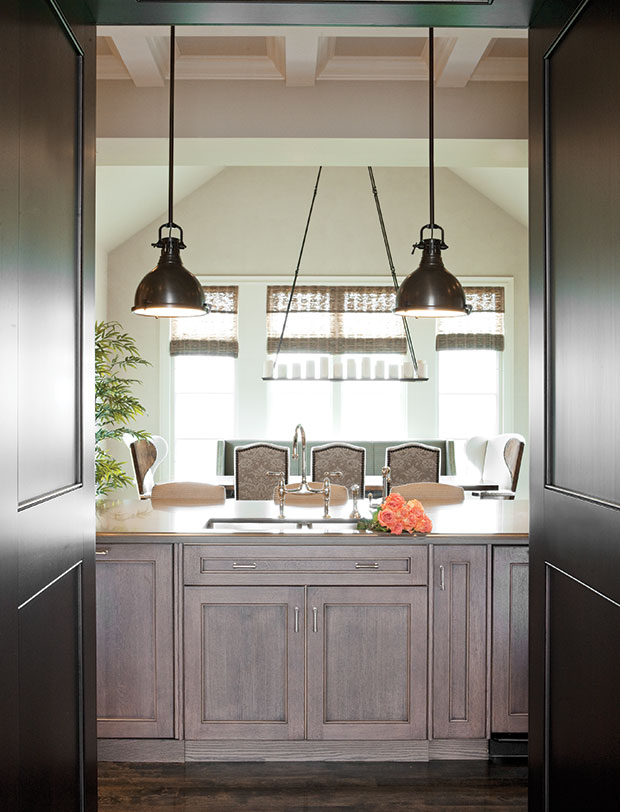 Nam Dang-Mitchell's design of a rustic kitchen with accent pendant lights.