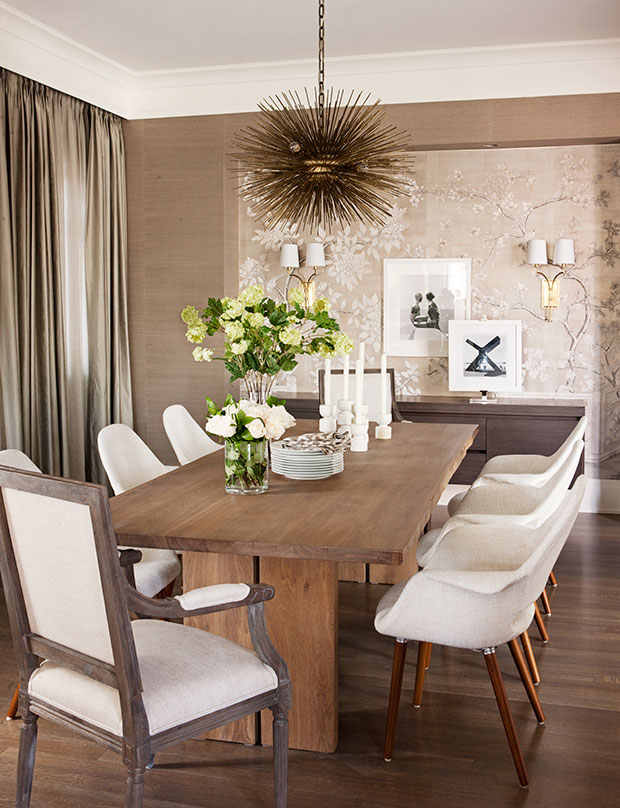 Nam Dang-Mitchell's design of a dining room that balances rustic and chic with a wood table and starburst chandelier.