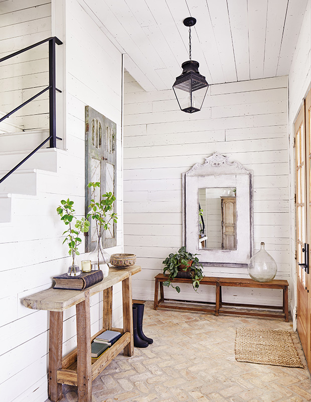 Joanna Gaines design entryway with rustic table, bench and mirror