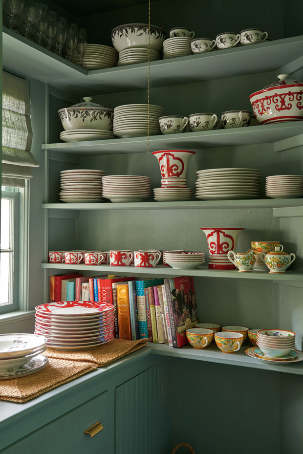 Holt Renfrew President Mario Grauso's kitchen with piles of pottery and plates