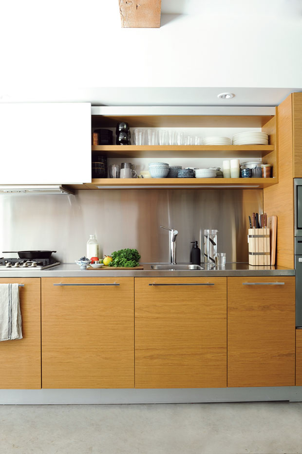 A natural wood cabinet in the kitchen