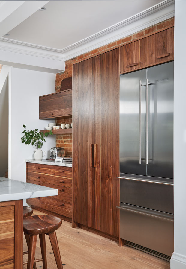 A natural wood cabinet in the kitchen