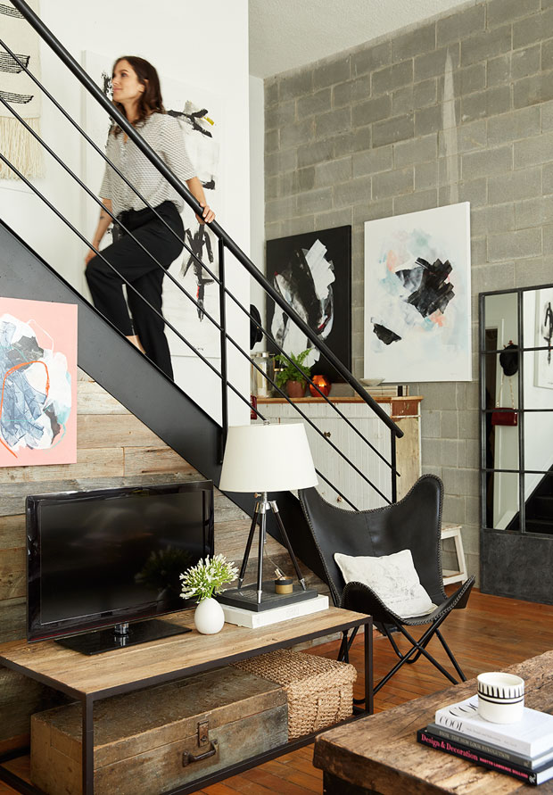 Amelie Simard walking up her stairs in her Montreal loft