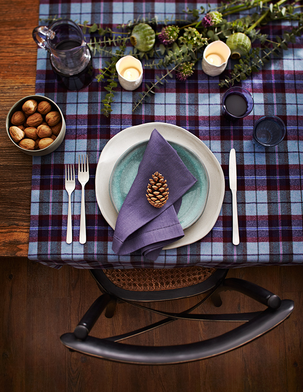 A purple tartan runner on a dining room table