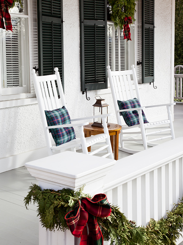 Two tartan pillows on outdoor rocking chairs