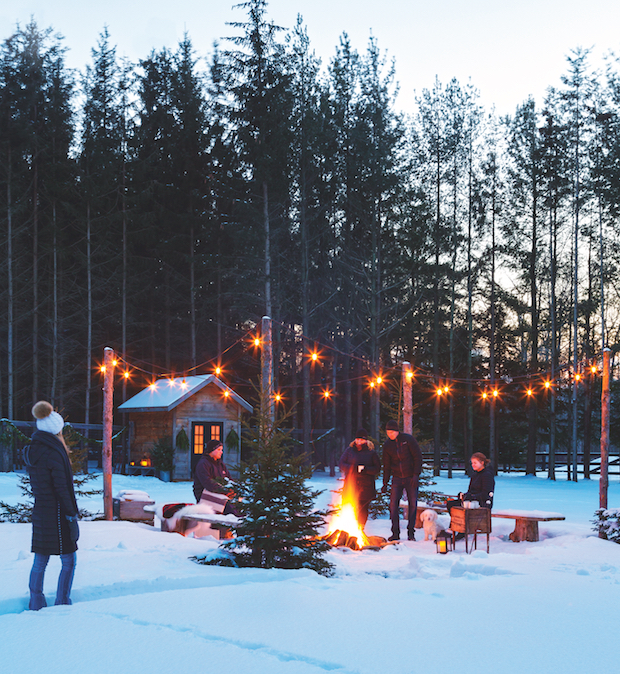 Hanging lights create a cozy outdoor atmosphere