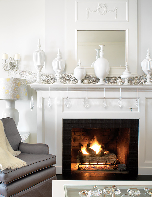 White fireplace with all-white accessories.