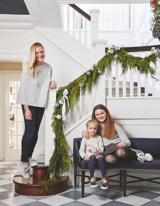 Kristin Andersons and her daughters in their front foyer