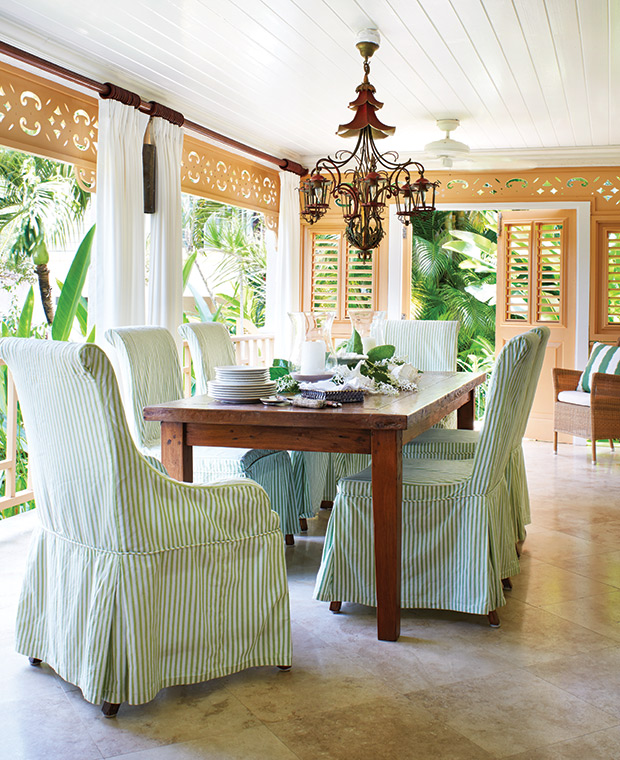 Outdoor dining room with striped seat covers