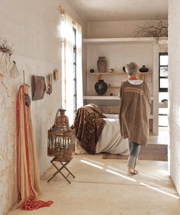 Living area with open shelving and Mexican pottery