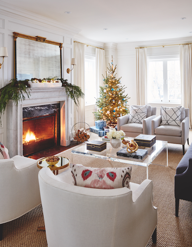 Christmas tree stands tall in this neutral living room
