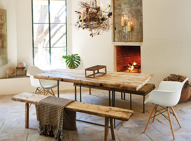 Rustic dining area with fireplace and wood table set