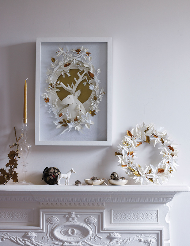 White mantel with gold accents.