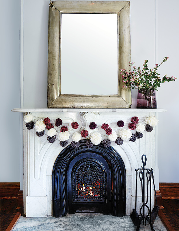 White fireplace with DIY decor.