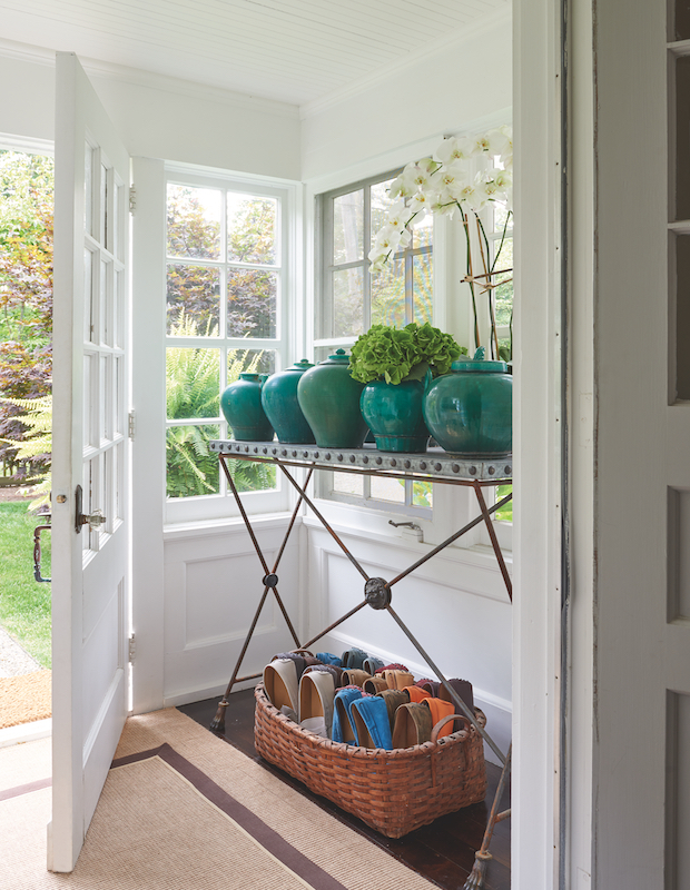 Unique entryway with teal potted plants