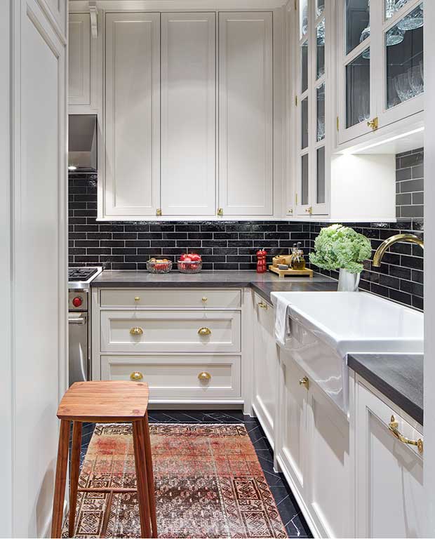 Kitchen with charcoal subway tiles
