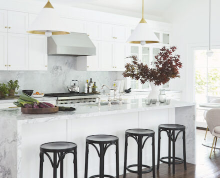White kitchen with accent black stools
