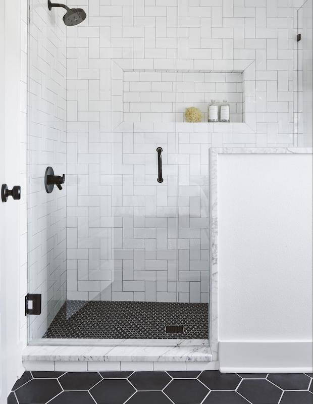 Minimalistic sleek bathroom with patterned subway tiles