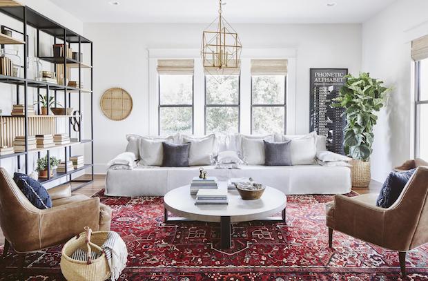 Living room with bright rug and neutral decor