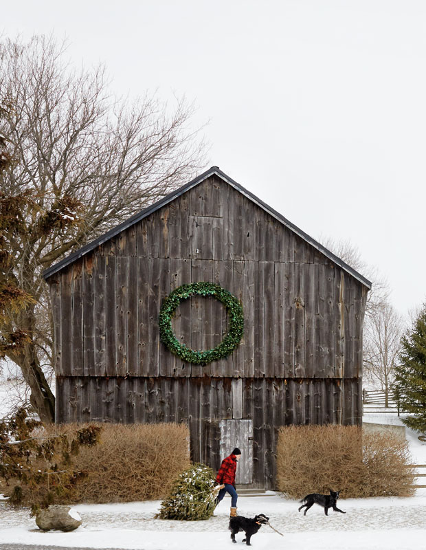 Holiday curb appeal — a rustic farmhouse with a large wreath