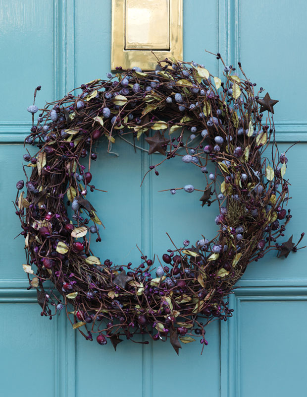 Holiday curb appeal — a twig wreath with berries