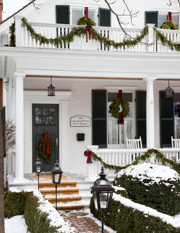 Holiday curb appeal — bows of garland, plaid and snow