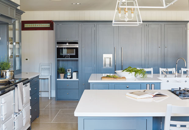 Kitchen with muted blue cabinetry.