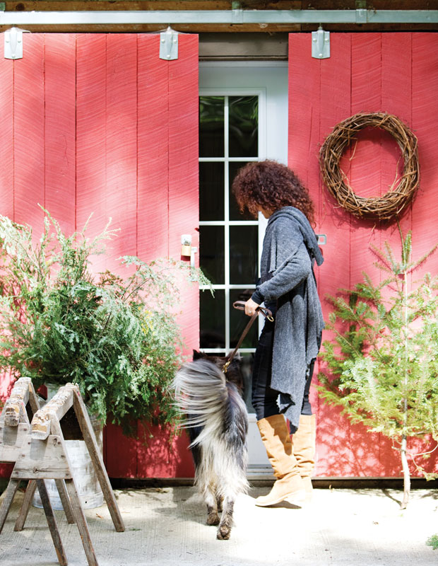 Holiday curb appeal — bright red doors and a natural wreath