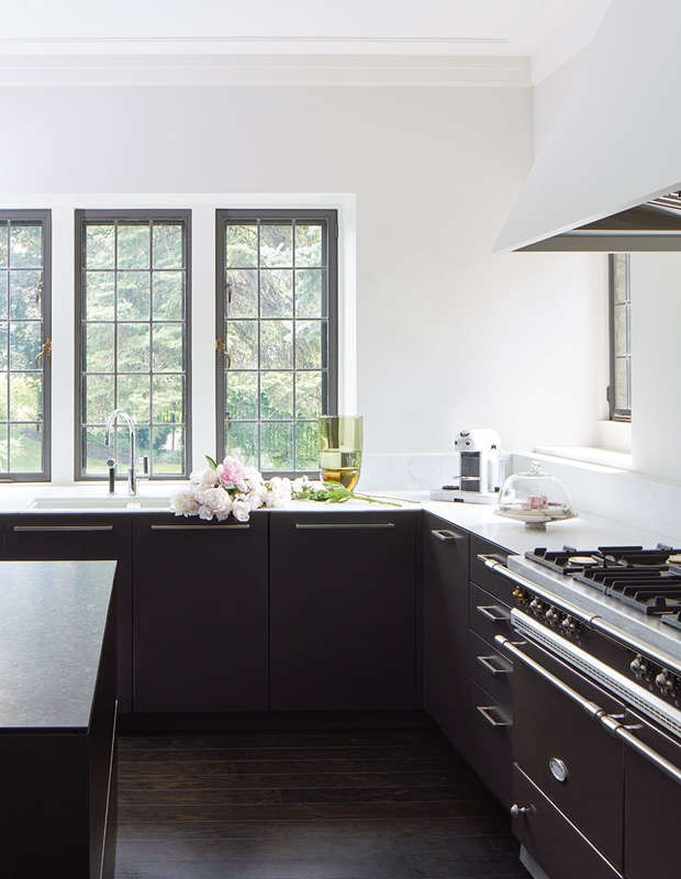 Julie Charbonneau kitchen with dark cabinets and white walls