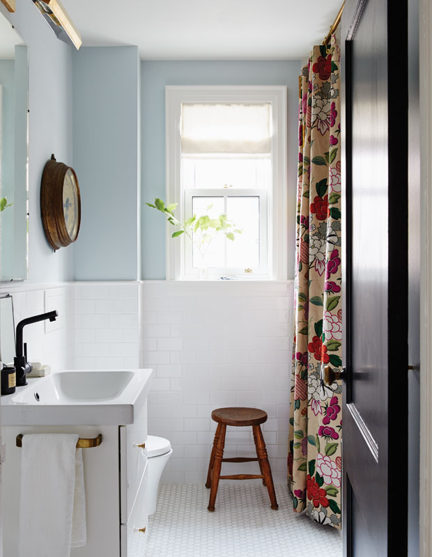 Top Pinterest Images of 2018 - a cozy bathroom with pale blue walls and an eye-catching shower curtain