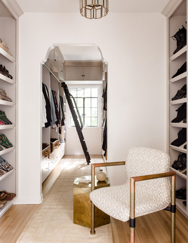 Nate Berkus and Jeremiah Brent all-white closet with patterned chair and shoe racks