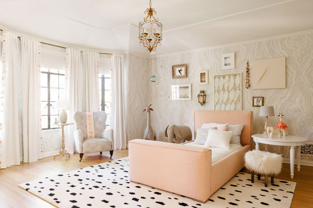 Nate Berkus and Jeremiah Brent kids bedroom with a blush bed, statement rug and textured wallpaper