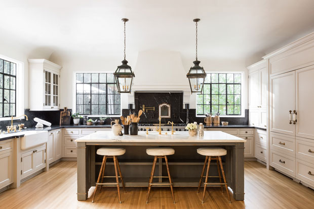 Nate Berkus and Jeremiah Brent kitchen with spacious island and lantern-like pendants