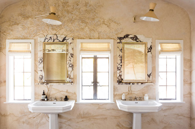 Nate Berkus and Jeremiah Brent principal bathroom with marble mirrors, elegant wallpaper and gold sconces
