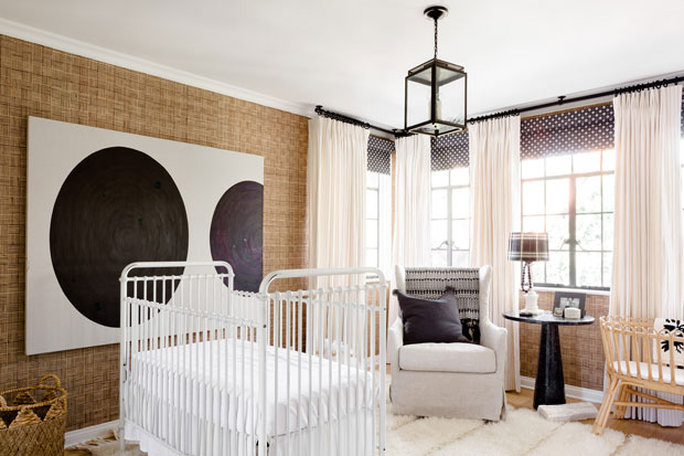 Nate Berkus and Jeremiah Brent nursery with a monochrome palette and eye-catching art