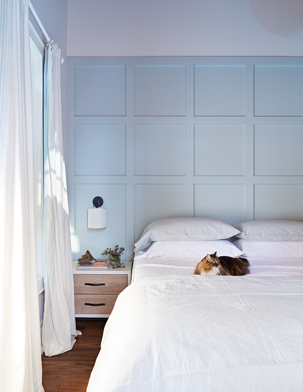 Minimalist spaces light blue wall with clean, fresh linens