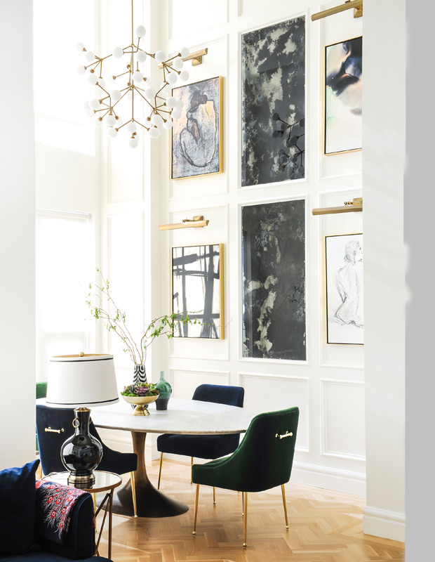 Denisa Nica continental condo dining room with an art gallery wall and moulding