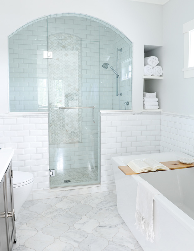 Minimalist spaces all-white bathroom with glass shower