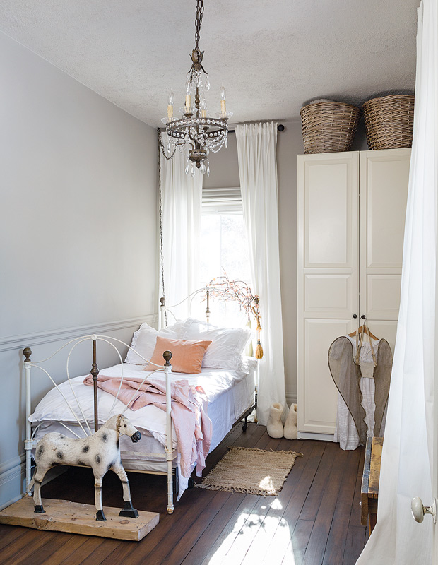 Designer Elle Patille bedroom with rocking horse and iron bed