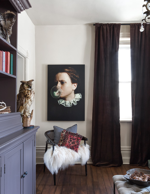 Designer Elle Patille with Victorian-inspired painting and luxe drapes