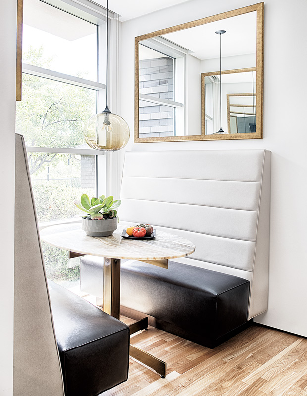 Breakfast nooks with a black and white leather banquette