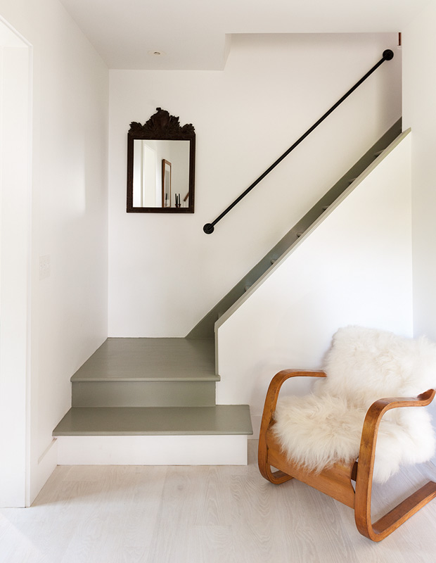 Minimalist spaces simple stairway with a black mirror