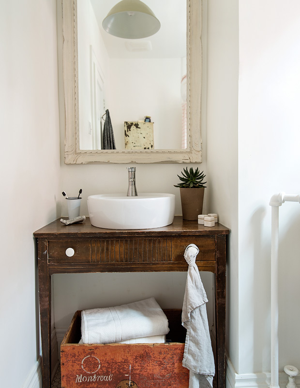 Organized family homes rustic bathroom with vintage vanity
