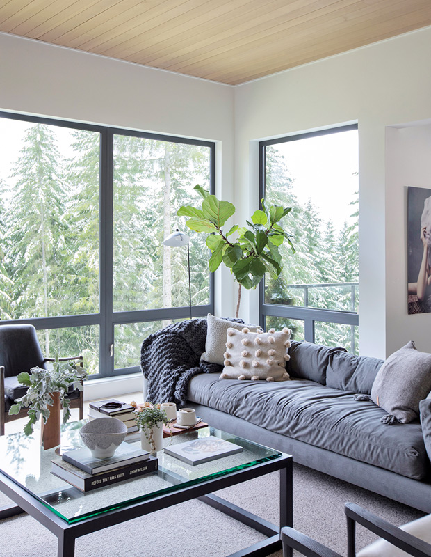 Ami McKay Whistler family home living room with views of forest