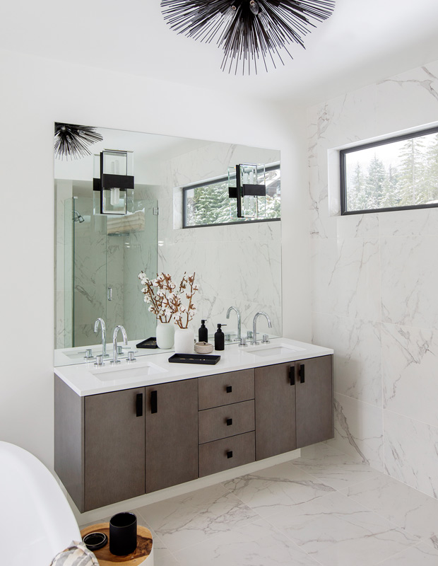 Ami McKay Whistler family home principal bathroom with floating vanity and floor-to-ceiling marble