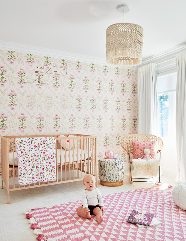 California family home nursery with floral wallpaper and seaside-inspired accents